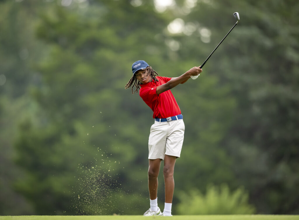 First Tee - Greater Richmond participant Justin Hartsfield follows through on a shot during the 2023 Redmond Cup