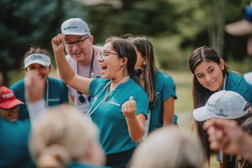 First Tee participant cheering.