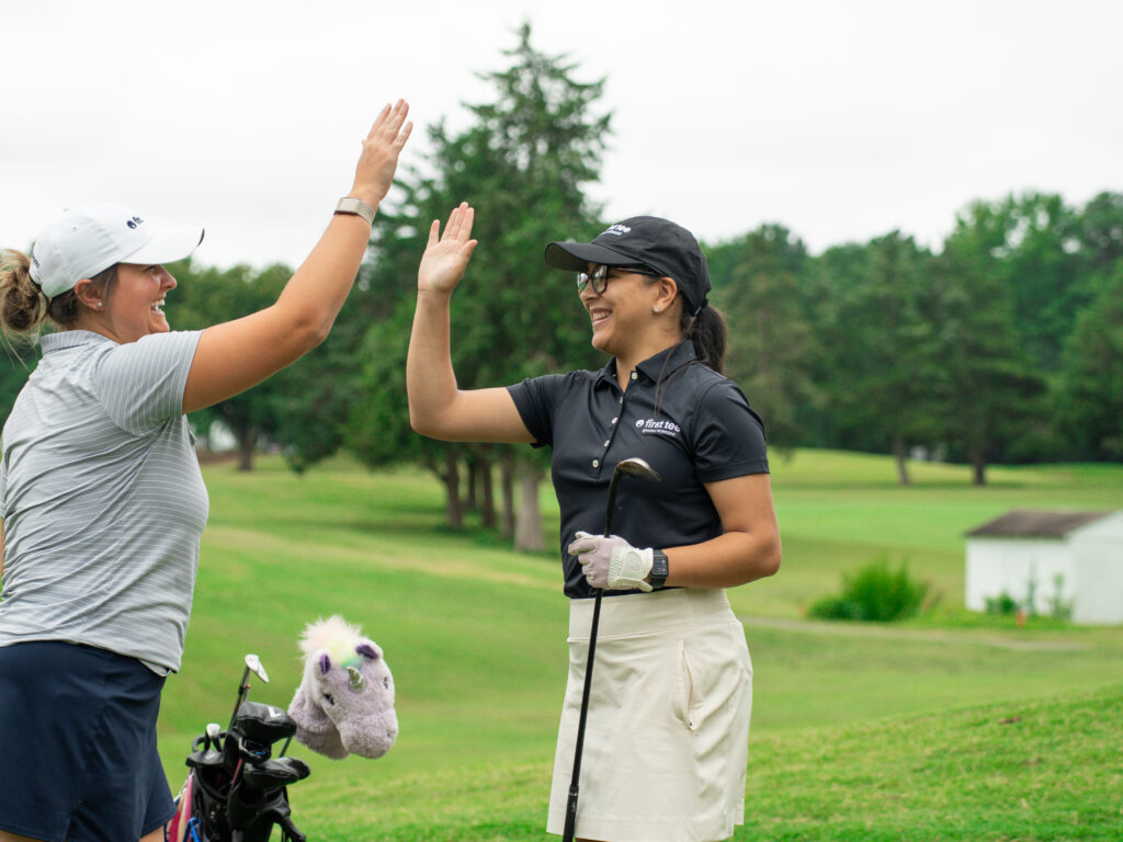 Coach Grace and participant high five